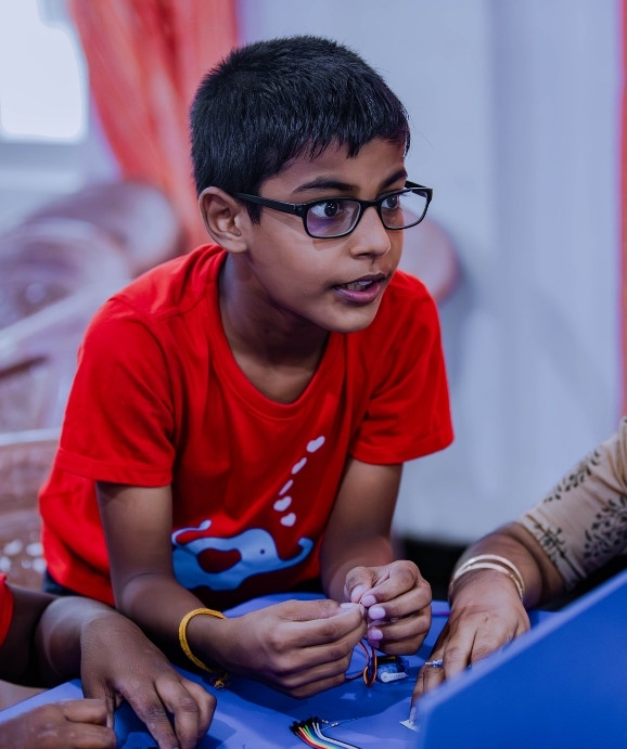 Instructor teaching software development to kids