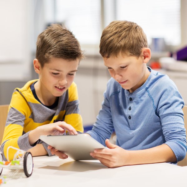 Two kids learning coding