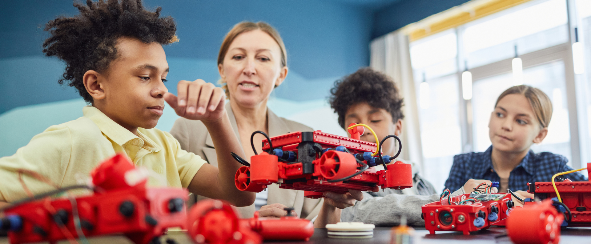 Kids learning robotics from the instructor