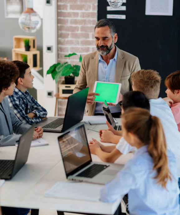 Instructor teaching software development to kids