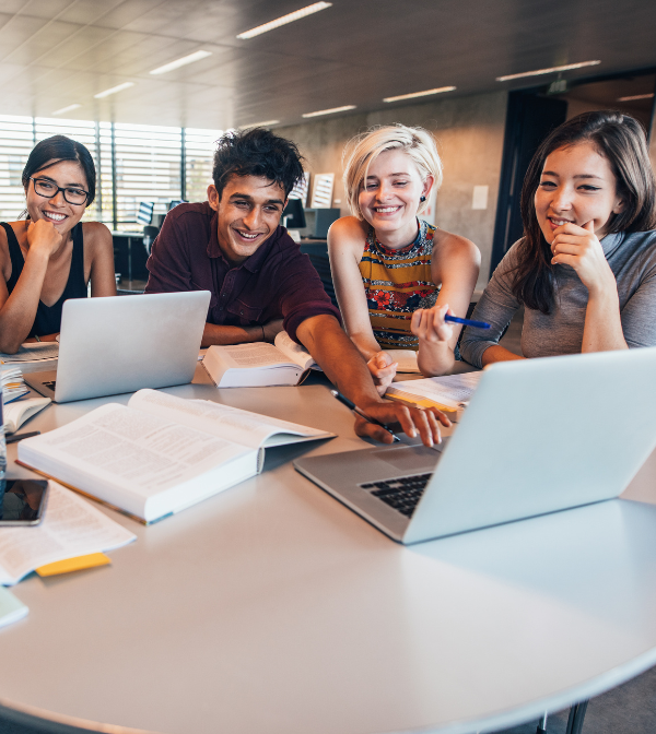 Students are happily working on a software development project